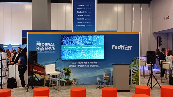 Booth and sign for Federal Reserve payments services at Nacha conference in May 2024.