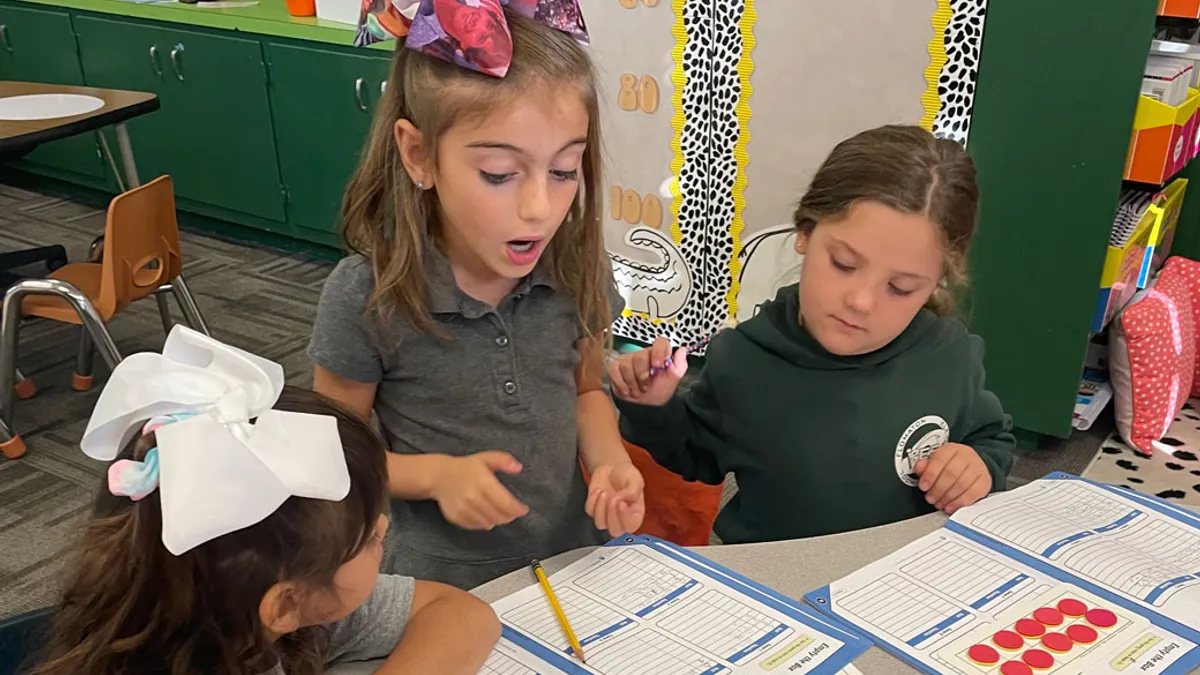 Young girls doing schoolwork together