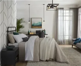 A bedroom with black-trimmed lighting.