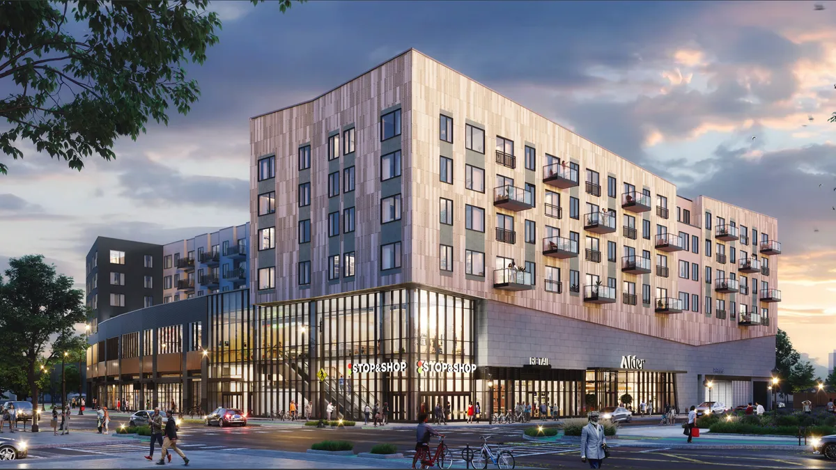 Light colored modern apartment building with a grocery on the ground floor