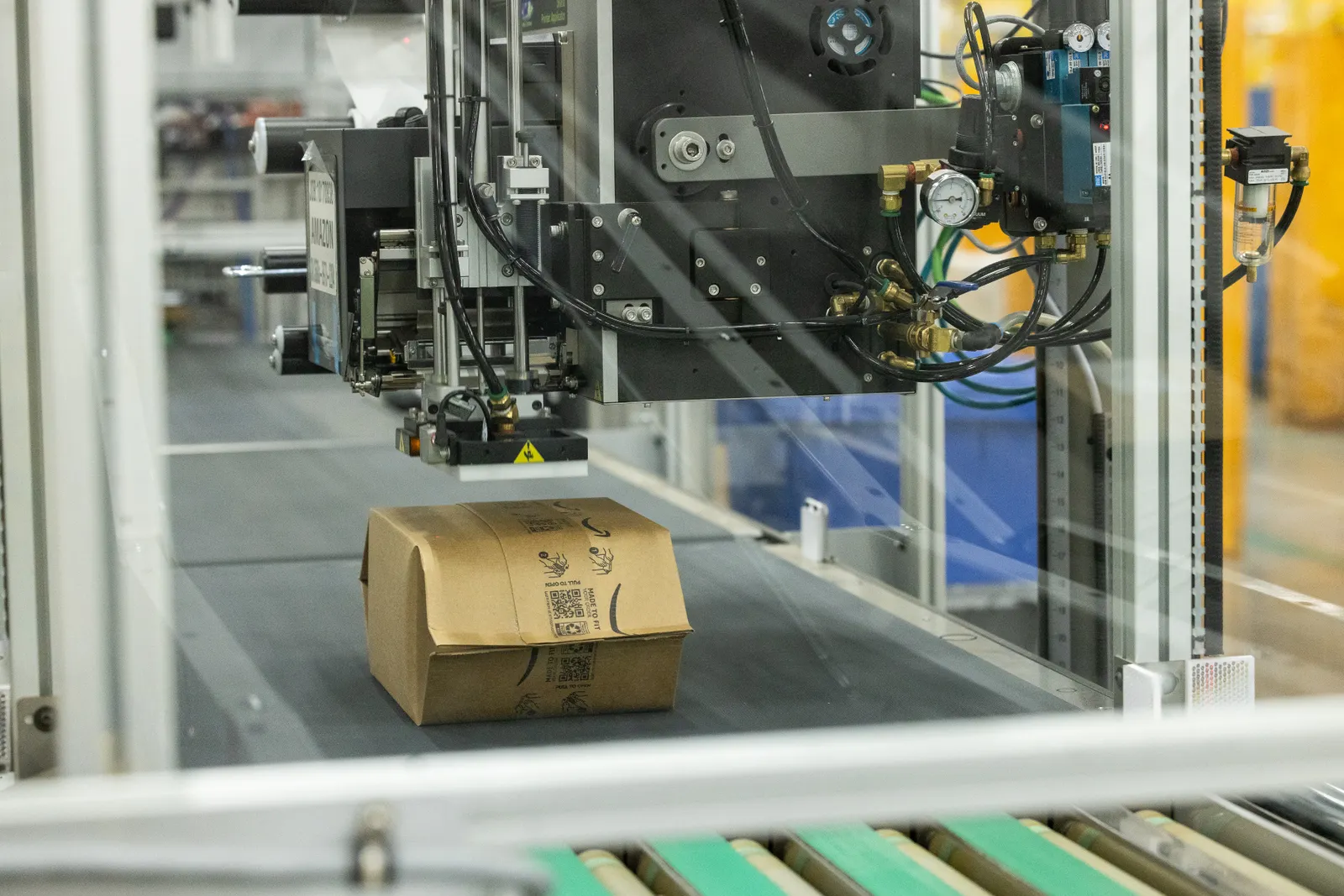 A flexible fiber package on a conveyor at a fulfillment center.