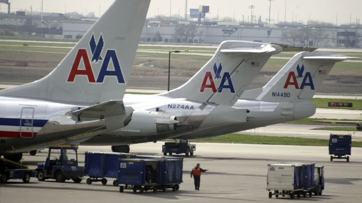 American Airlines jets sit on the tarmac as an American Eagle jet taxis to the gate at O'Hare International Airport April 25, 2003 in Chicago.