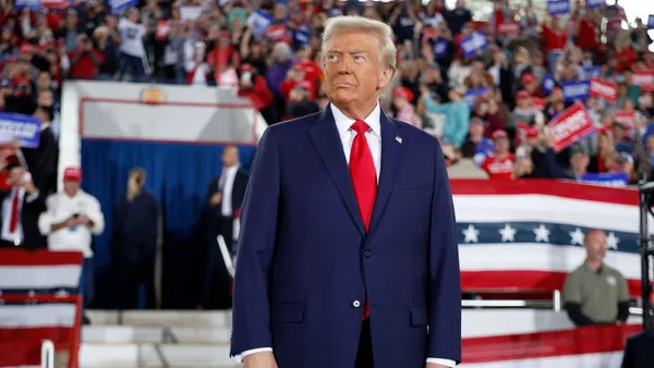 President Donald Trump takes the stage during a campaign rally at the J.S. Dorton Arena on November 04, 2024 in Raleigh, North Carolina.