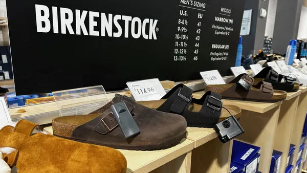 A display of Birkenstock shoes on a shelf inside a DSW store.