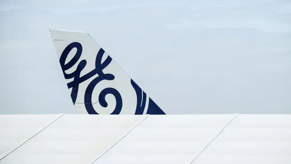 The General Electric logo is seen on the tailfin of an aircraft.