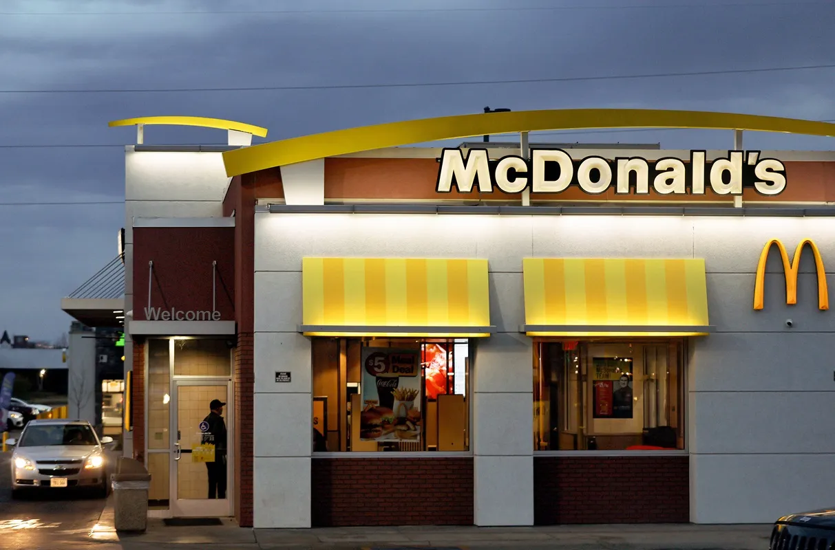 An image of a white building with yellow signage that says McDonald&#x27;s