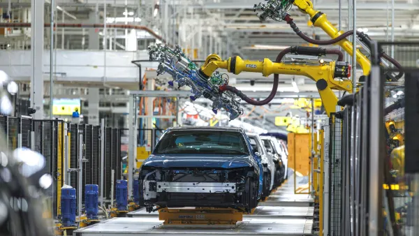 Robots in action on the new line at Toyota Kentucky as future Camrys seamlessly roll through the production process.