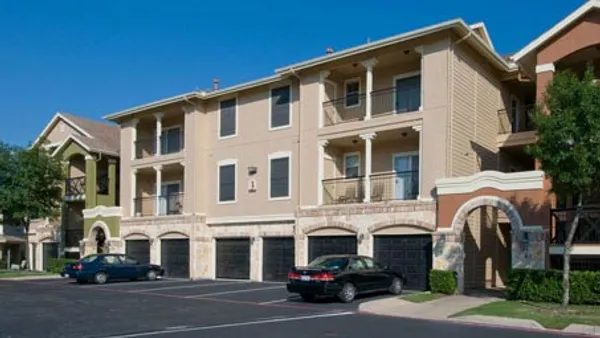 White, garden-style apartment property