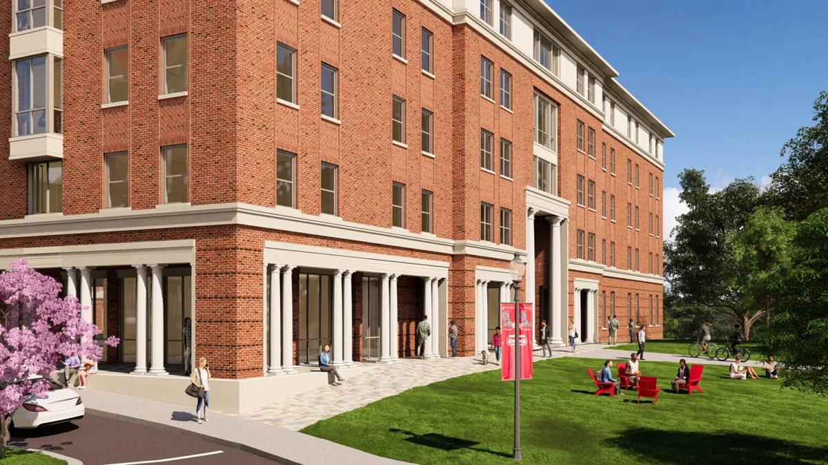A student dormitory surrounded by chairs and people.