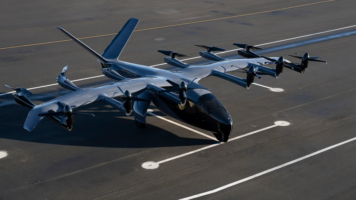 View from above of an advanced electric takeoff and landing, or eVTOL, aircraft, parked.