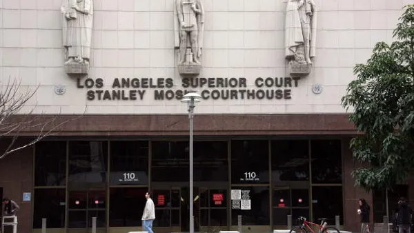 A person walks by a courthouse