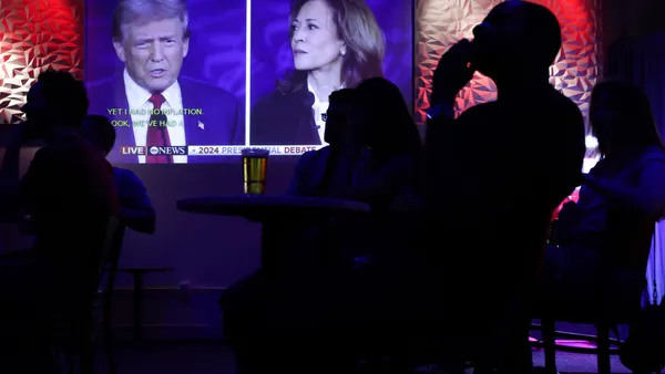 People watch the presidential debate during a debate watch party at Penn Social on Sept. 10, 2024, in Washington