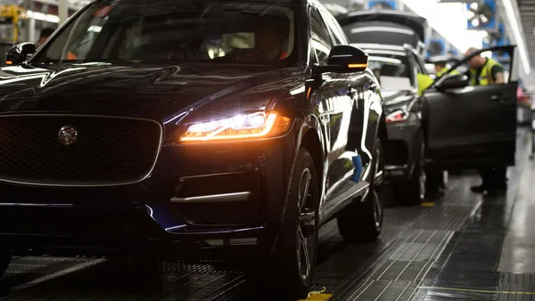 Vehicles are checked before moving to the next stage of production at the Jaguar Land Rover factory on March 1, 2017 in Solihull, England.