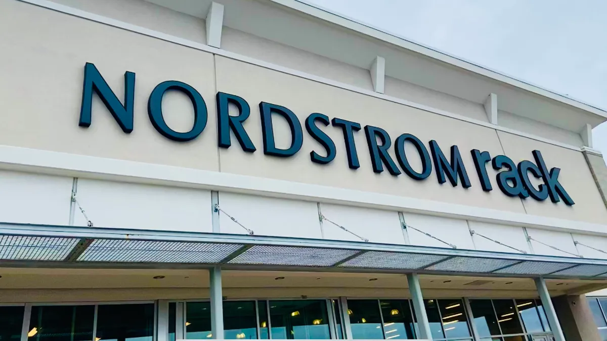 A large white sign reads "Nordstrom Rack" in dark blue capital letters.