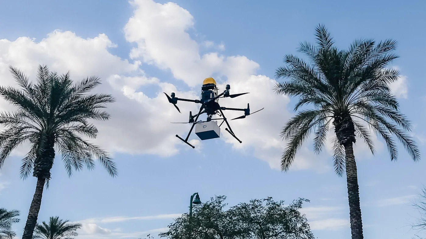 A Flyby drone carrying a delivery.