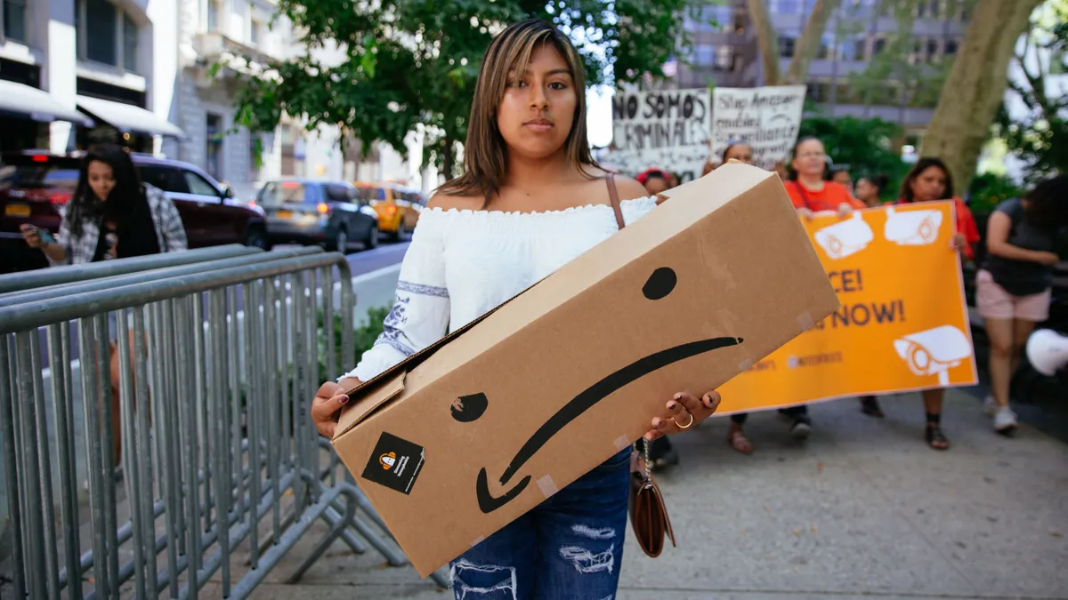 Protestors march to a building where Amazon owner Jeff Bezos owns property on July 15, 2019 in New York City.