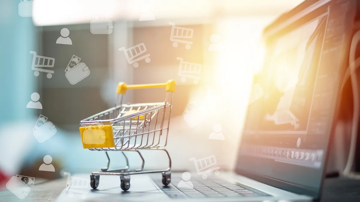 Image of a grocery cart floating over a laptop keyboard