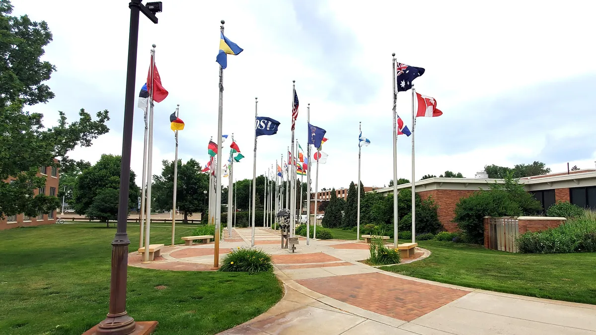 A wide shot of several flags at Dickinson State University.