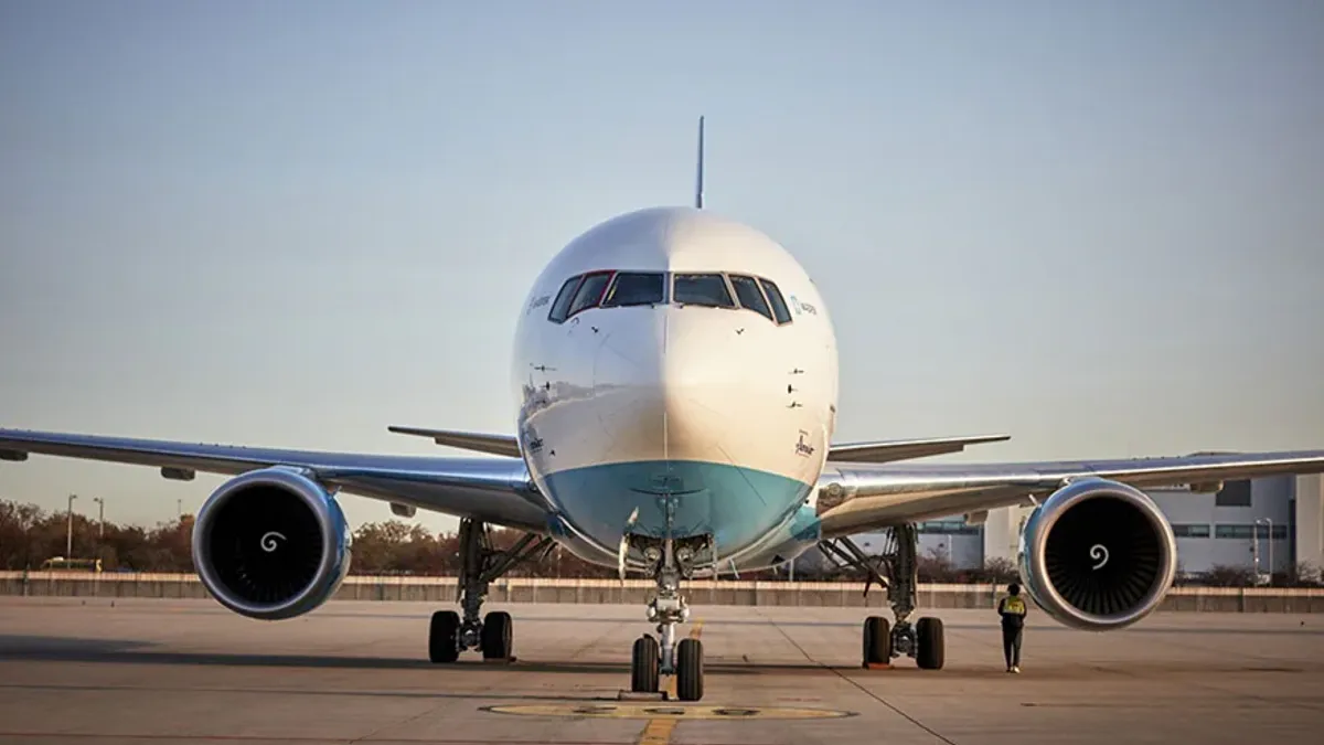 A frontal view of an airplane on a tarmac.