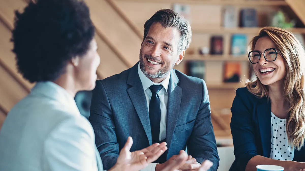 Three lawyers chat in an office