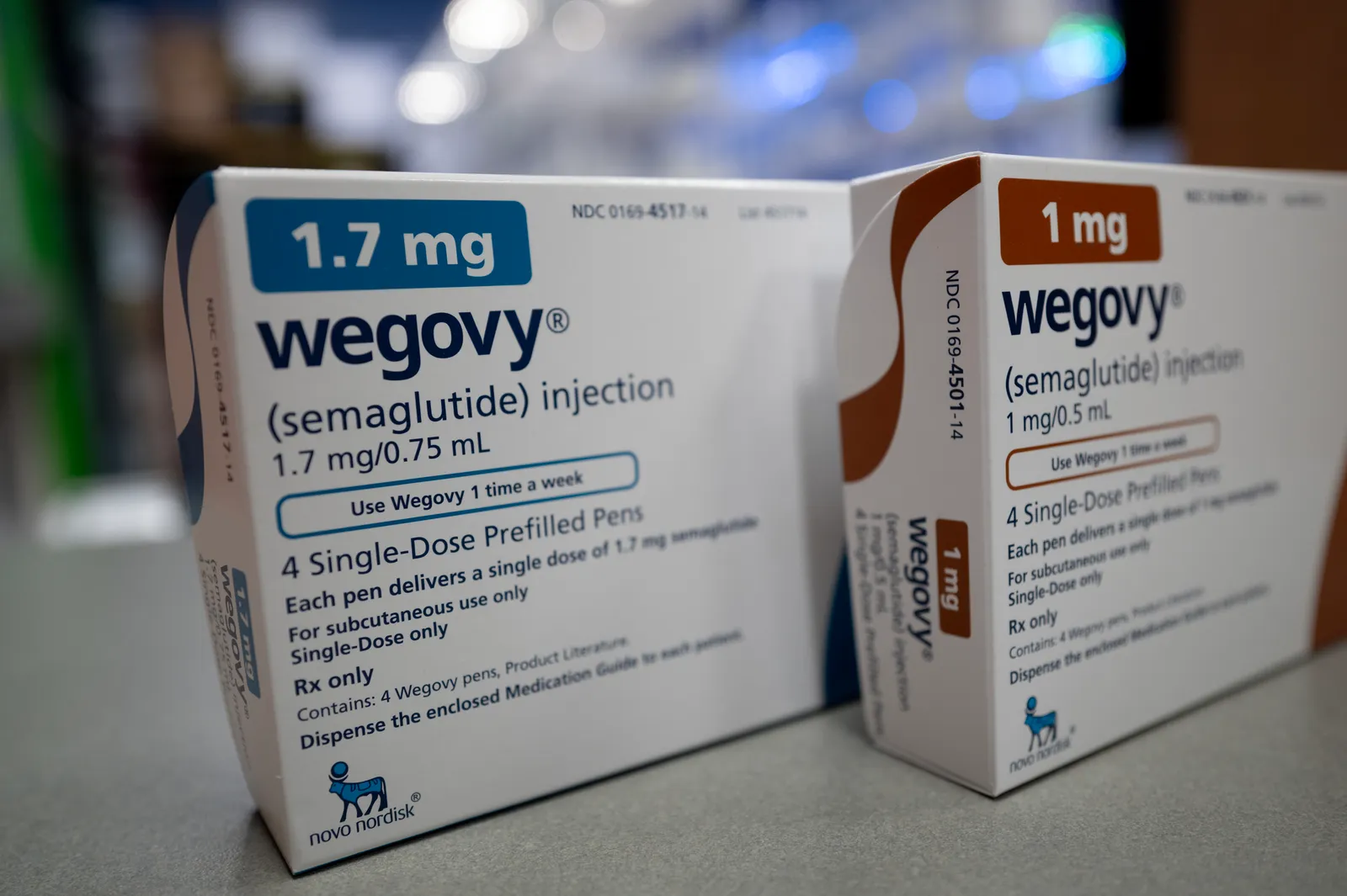 Two prescription drug cartons stand side by side on a counter, each bearing the word Wegovy.