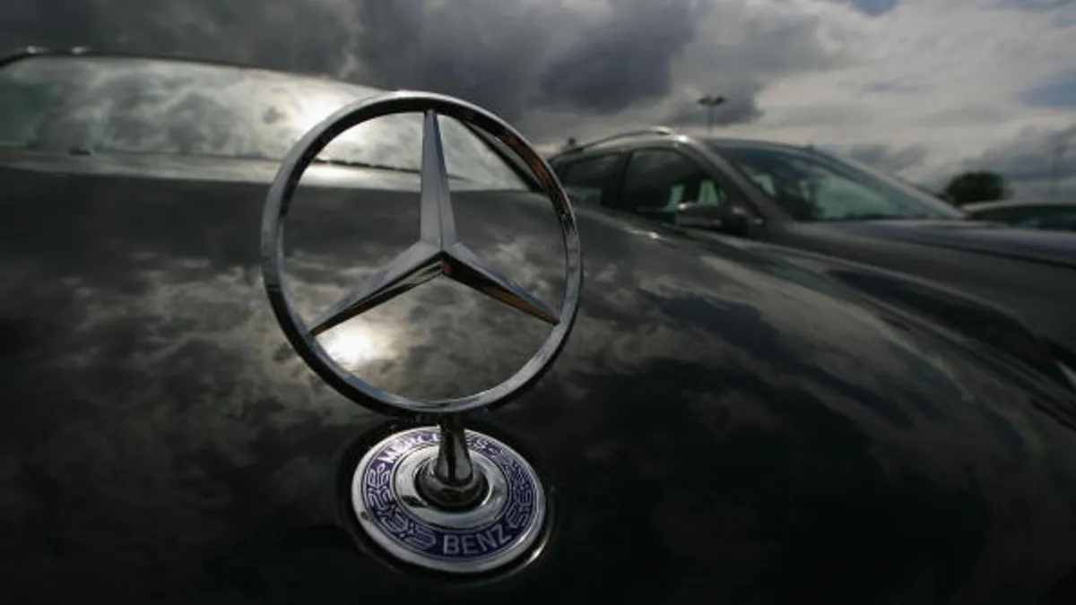 Mercedes-Benz cars are parked waiting for shipment July 26, 2005 in Bischofsheim near Mainz, Germany.