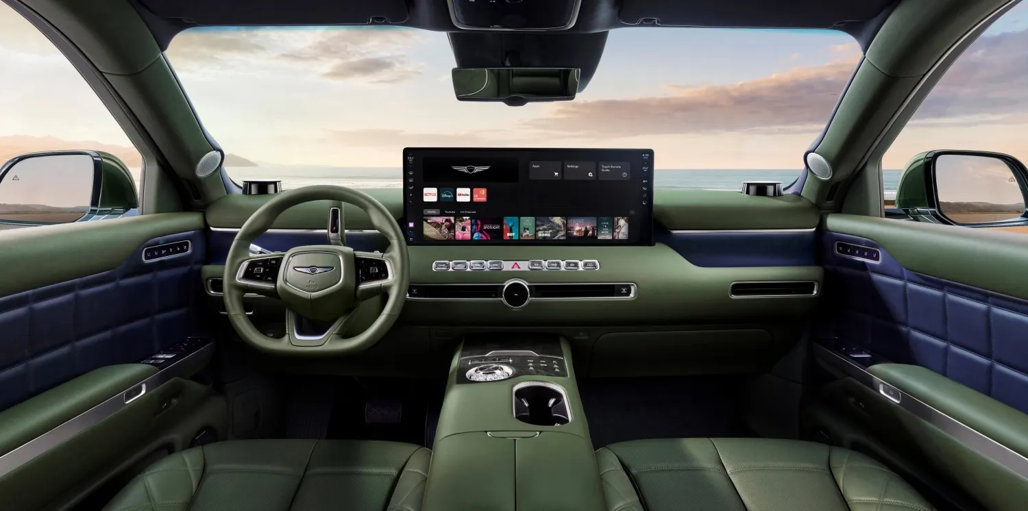 The dashboard, steering wheel and infotainment screen in the Genesis GV90 electric luxury SUV.