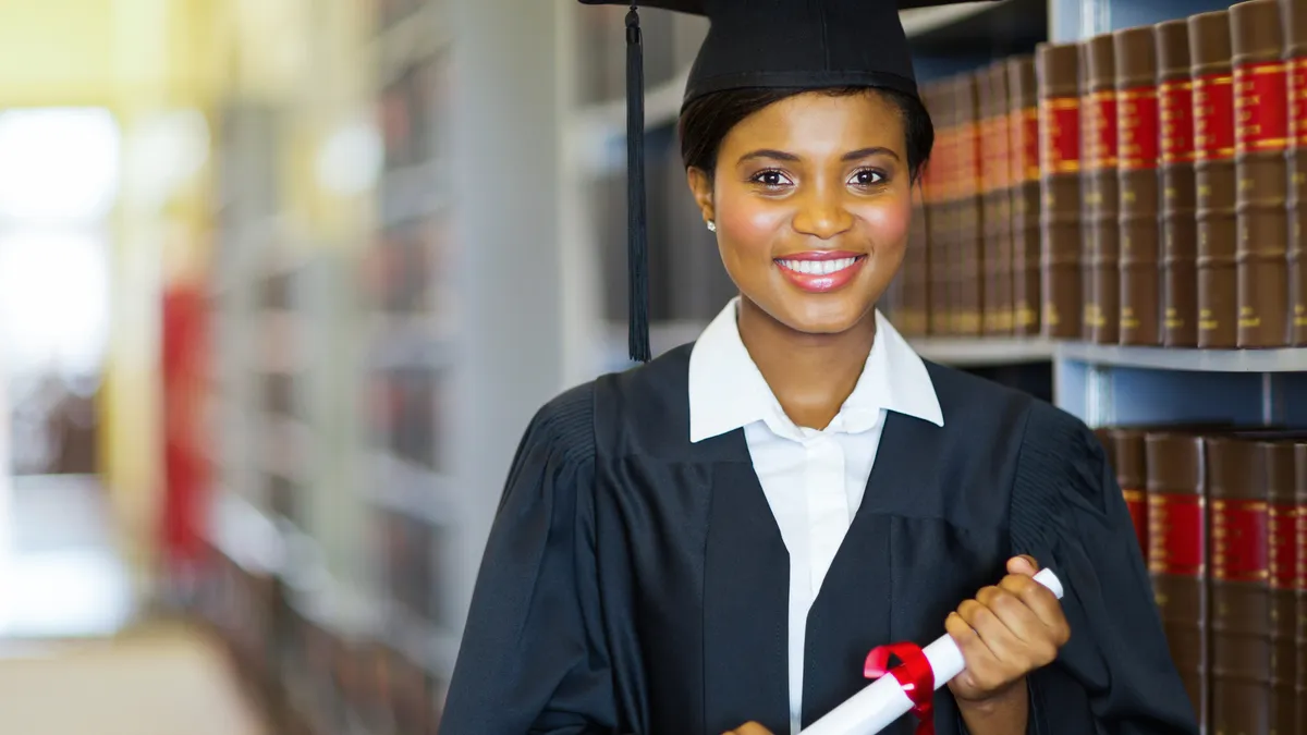 A law school graduate with her diploma