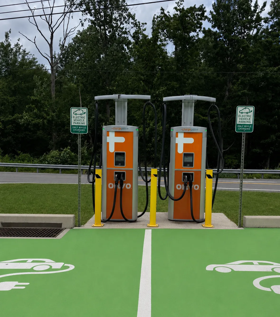 A photo of electric vehicle chargers installed in a parking lot. The chargers say Onvo.