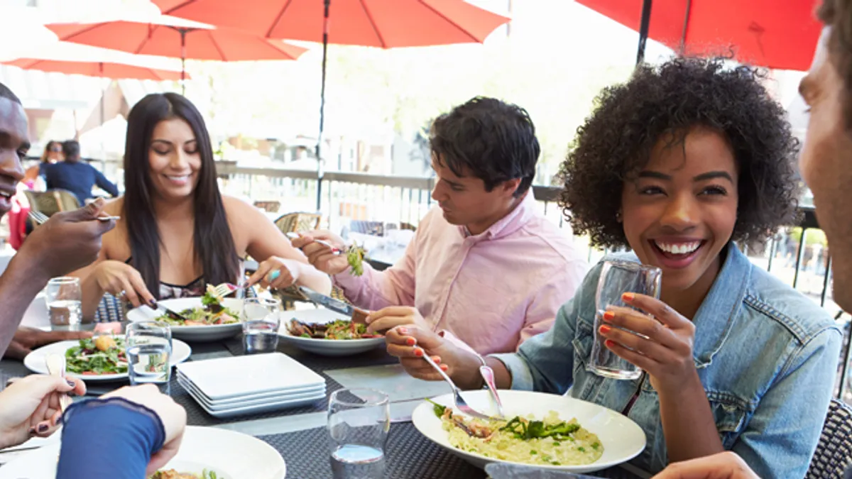 People enjoying eating together