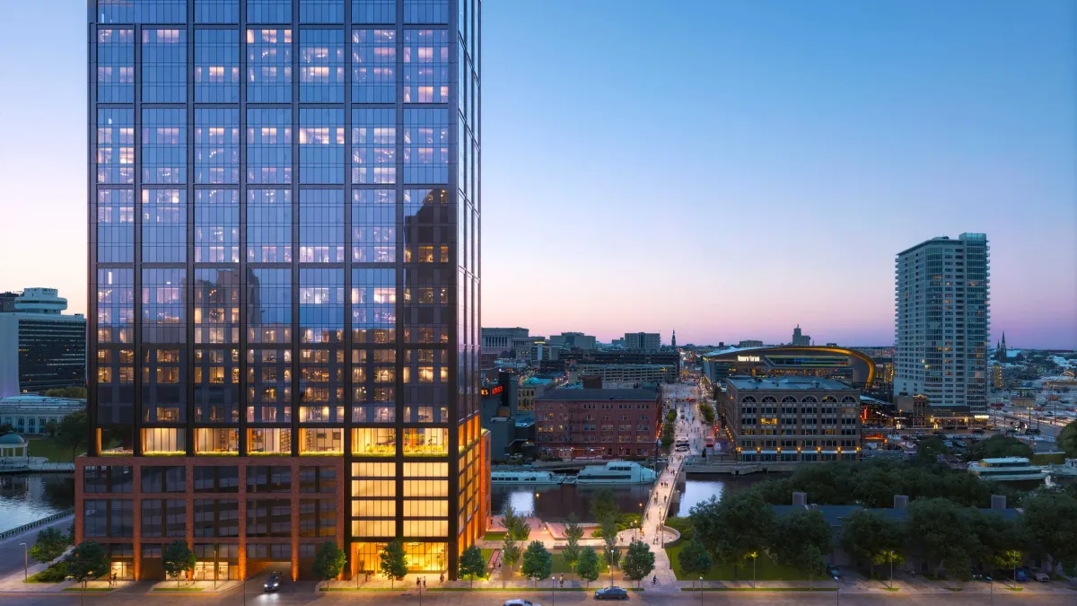 A rendering of a tall, wood-covered building looms in the foreground.