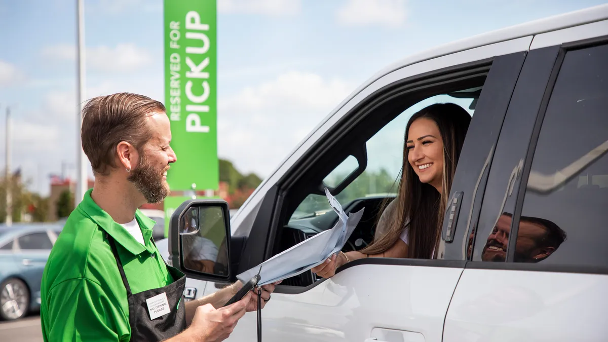 Publix employee delivering someone's pharmacy order to their car window