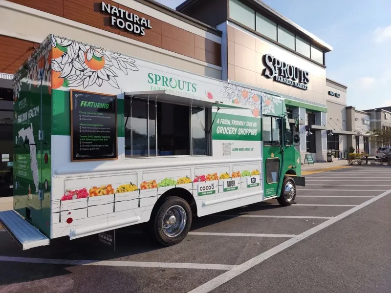 Sprouts Mobile Truck parked in front of a Sprouts Farmers Market store