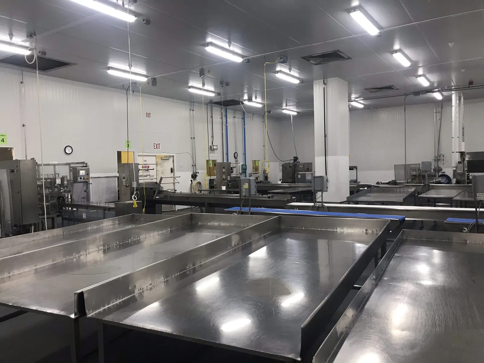 A photo of food production areas, mostly made of stainless steel, in a production facility.