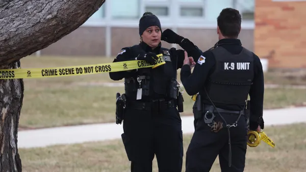 Police put up crime scene tape at Perry High School in Iowa following a school shooting on January 4, 2024.