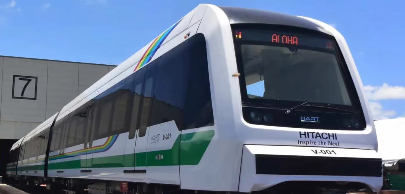 A HART light rail train leaves a station.