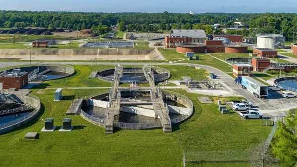 An aerial shot on a bright day of an industrial site that caters to wastewater treatment.