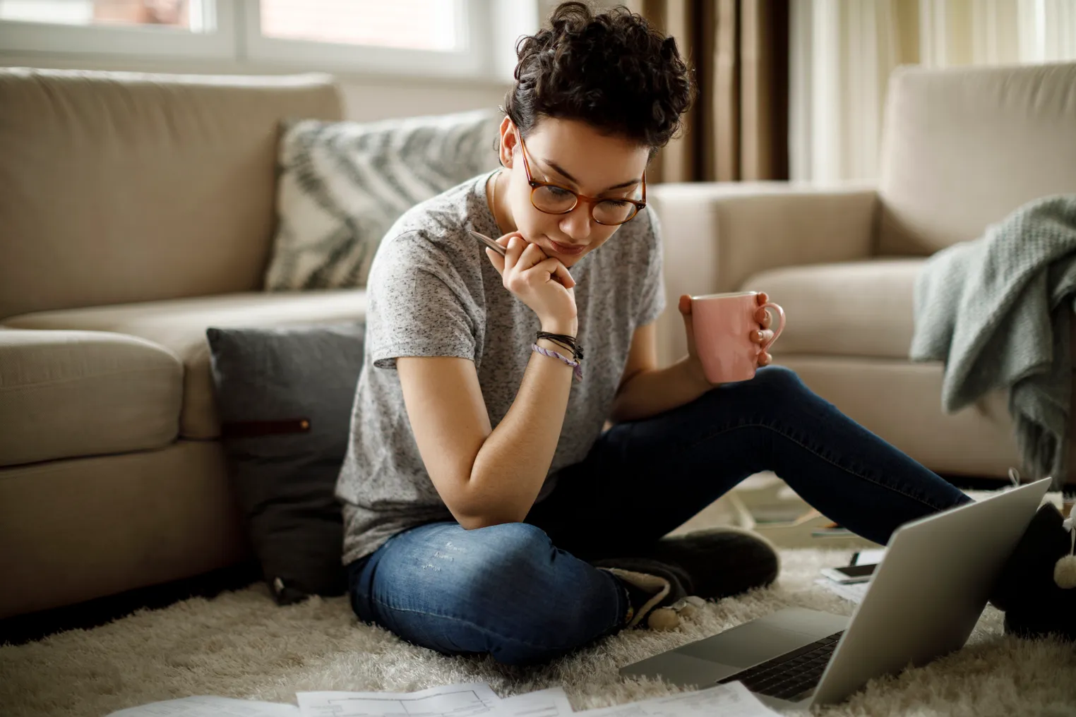 Young woman working at home - stock photo