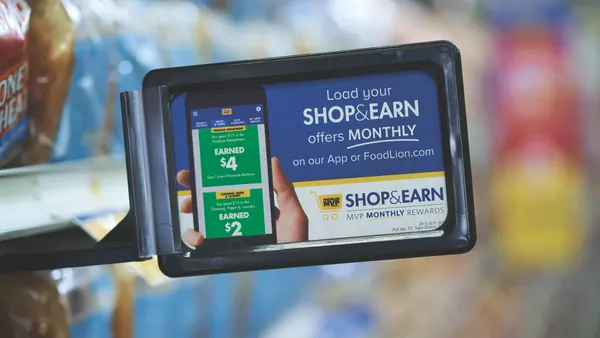 An in-store sign for a grocer's loyalty program.
