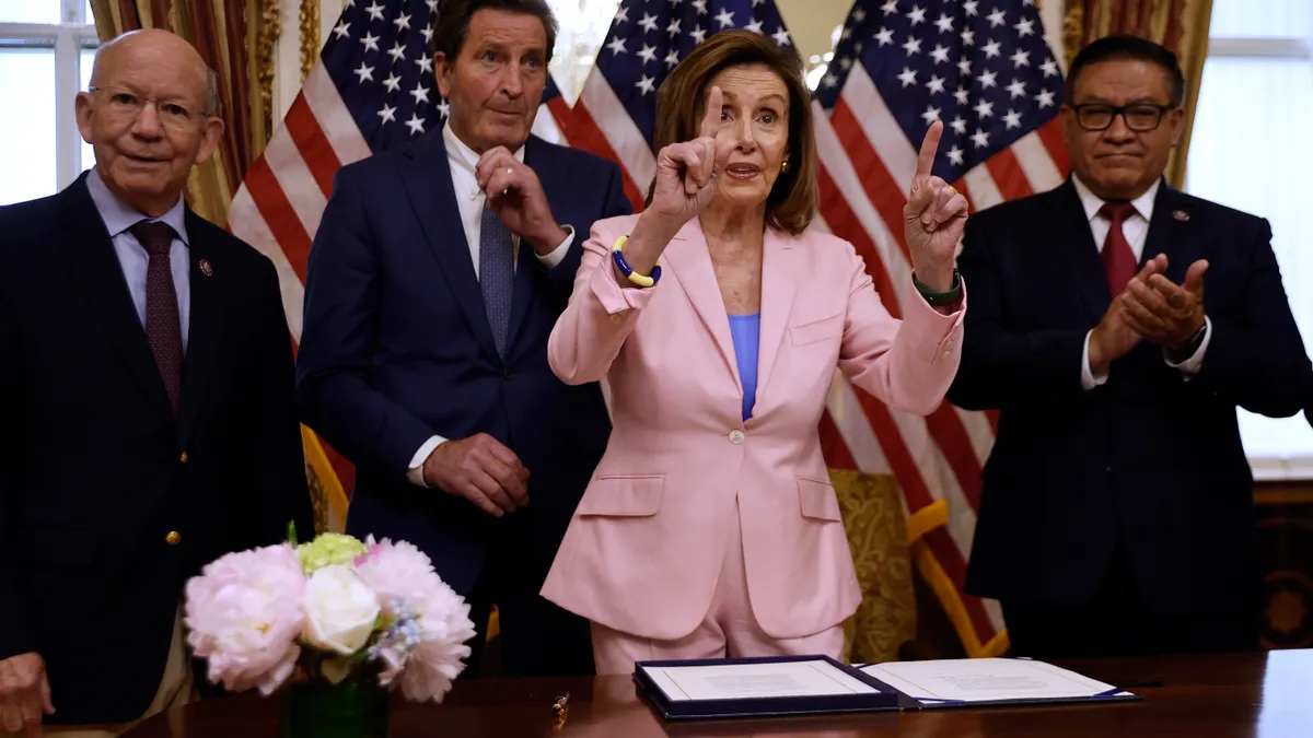 Speaker of the House Nancy Pelosi (D-CA) (C) speaks to reporters with (L-R) Rep. Peter DeFazio (D-OR), Rep. John Garamendi (D-CA) and Rep. Salud Carbajal (D-CA) during an enrollment ceremony for the O