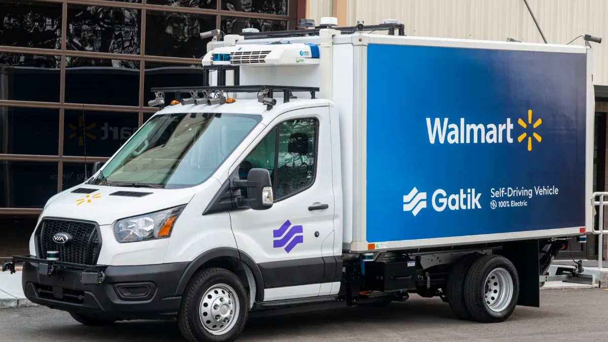 A Walmart and Gatik electric autonomous box truck sits parked.