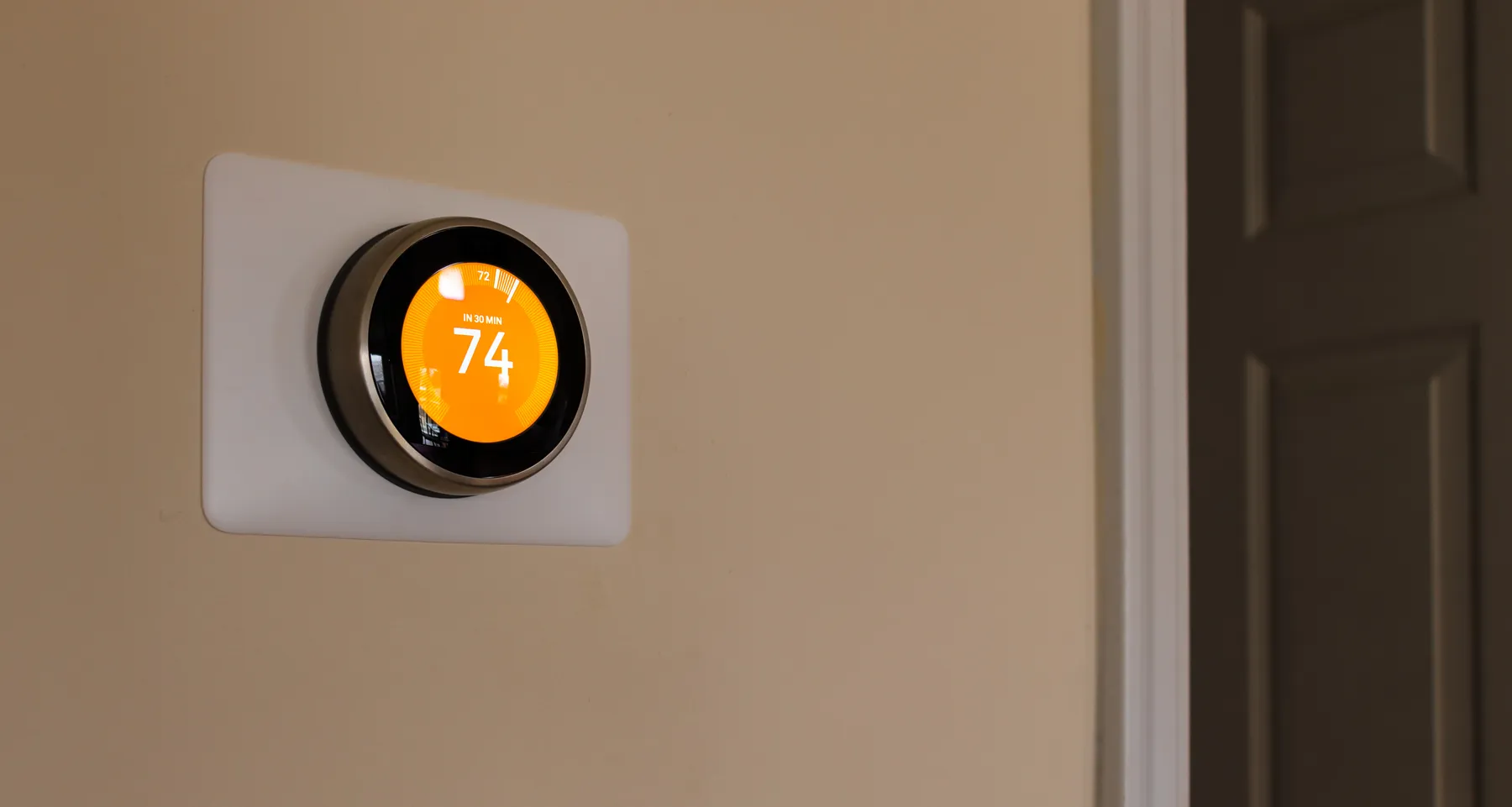 A smart thermostat in a home.