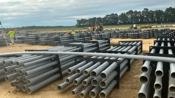 Construction workers prepare the duct bank for installation.