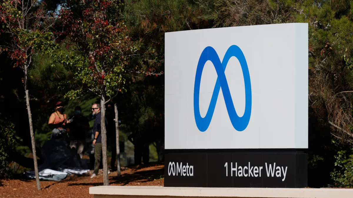 Blue infinity sign Meta logo on a billboard.