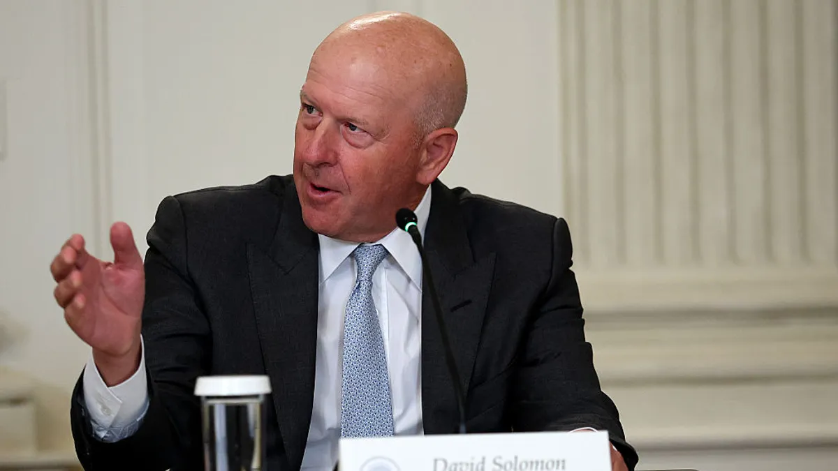 David Solomon, CEO of Goldman Sachs, gestures and looks to his right while speaking.