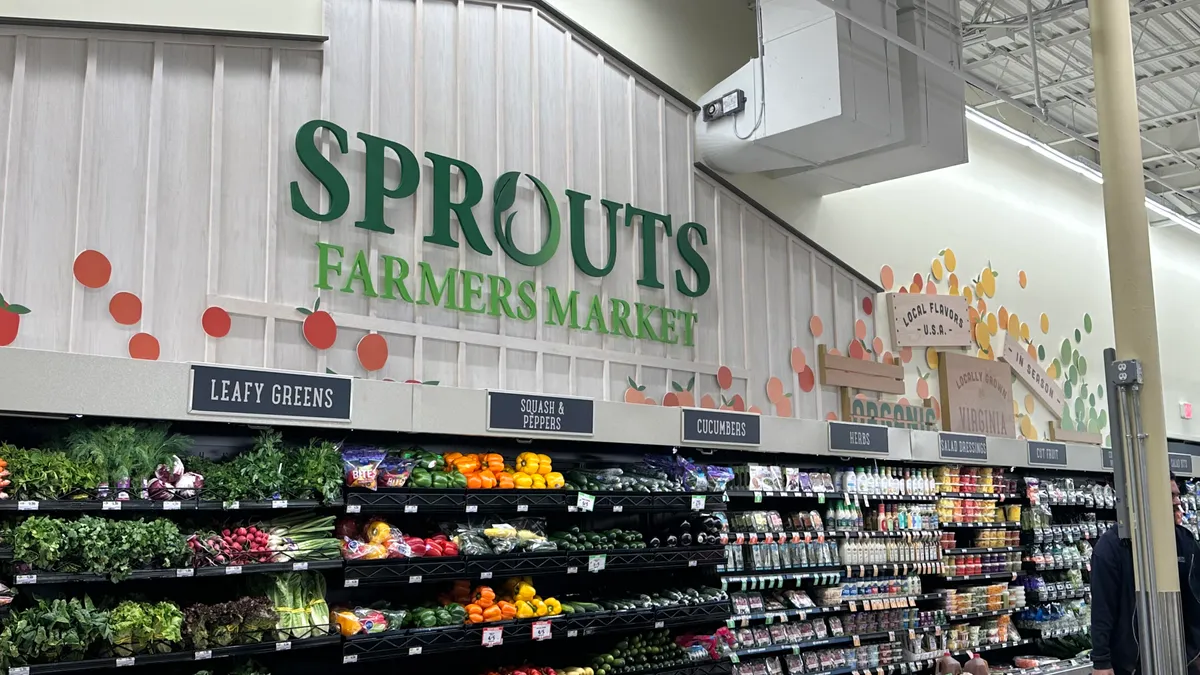 New logo display above produce wall at Manassa, Virginia, Sprouts Farmers Market