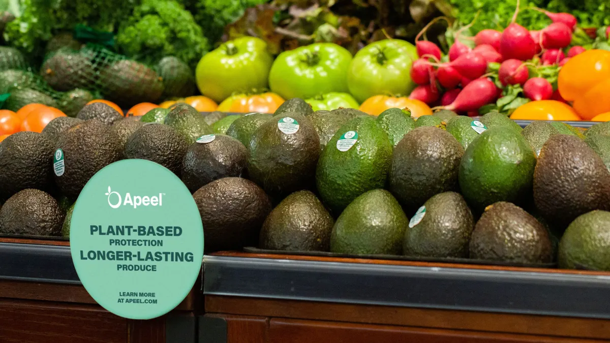 Apeel sign and stickers on avocados