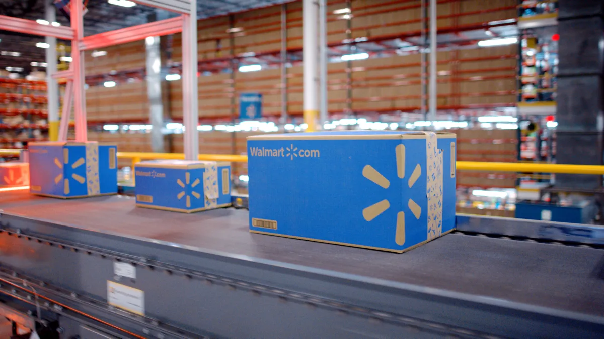 Walmart parcels to be shipped by Walmart Fulfillment Services move down a conveyor belt.