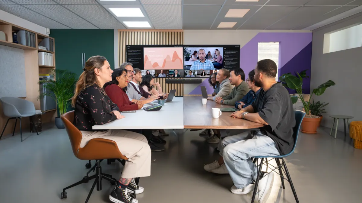 A group of people in a colorful meeting room