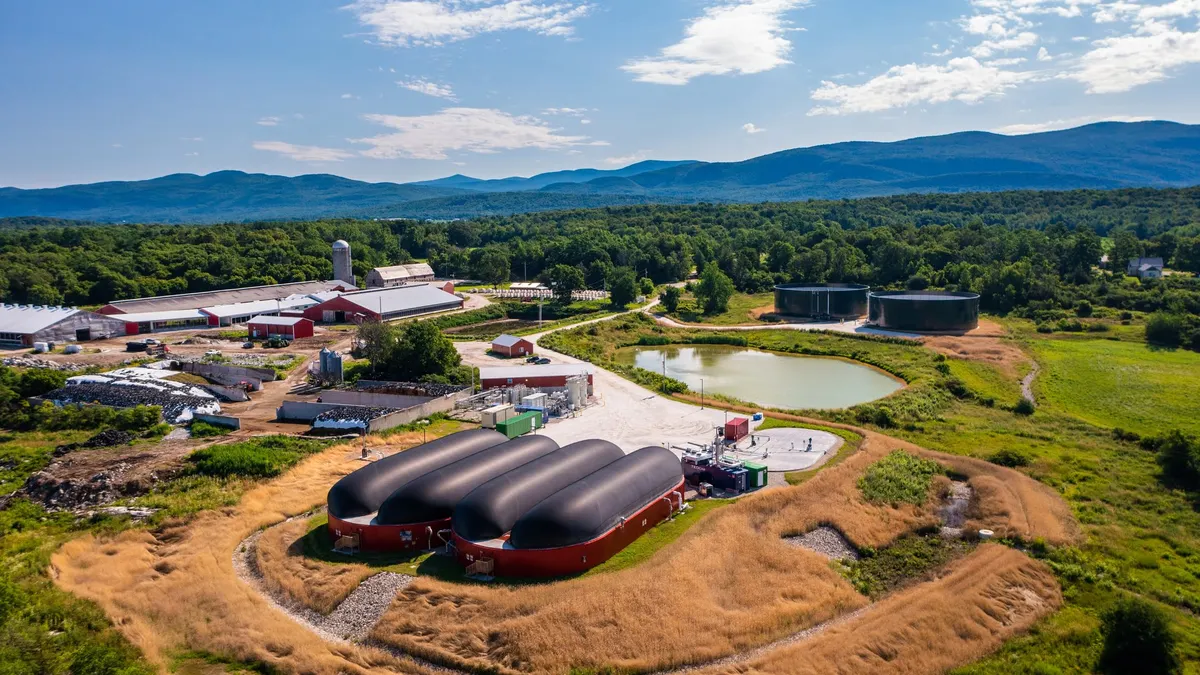 Industrial organics recycling site located on a Vermont farm, with mountains and blue sky in the background